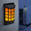 LED-es szolár fali lámpa - lángeffekttel - fekete, rácsos